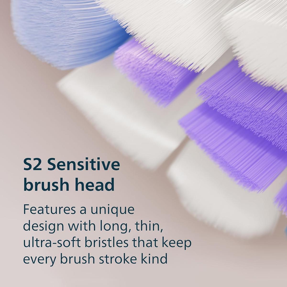 Close-up of a Philips Sonicare S2 Sensitive brush head with densely packed, ultra-soft white and purple bristles.