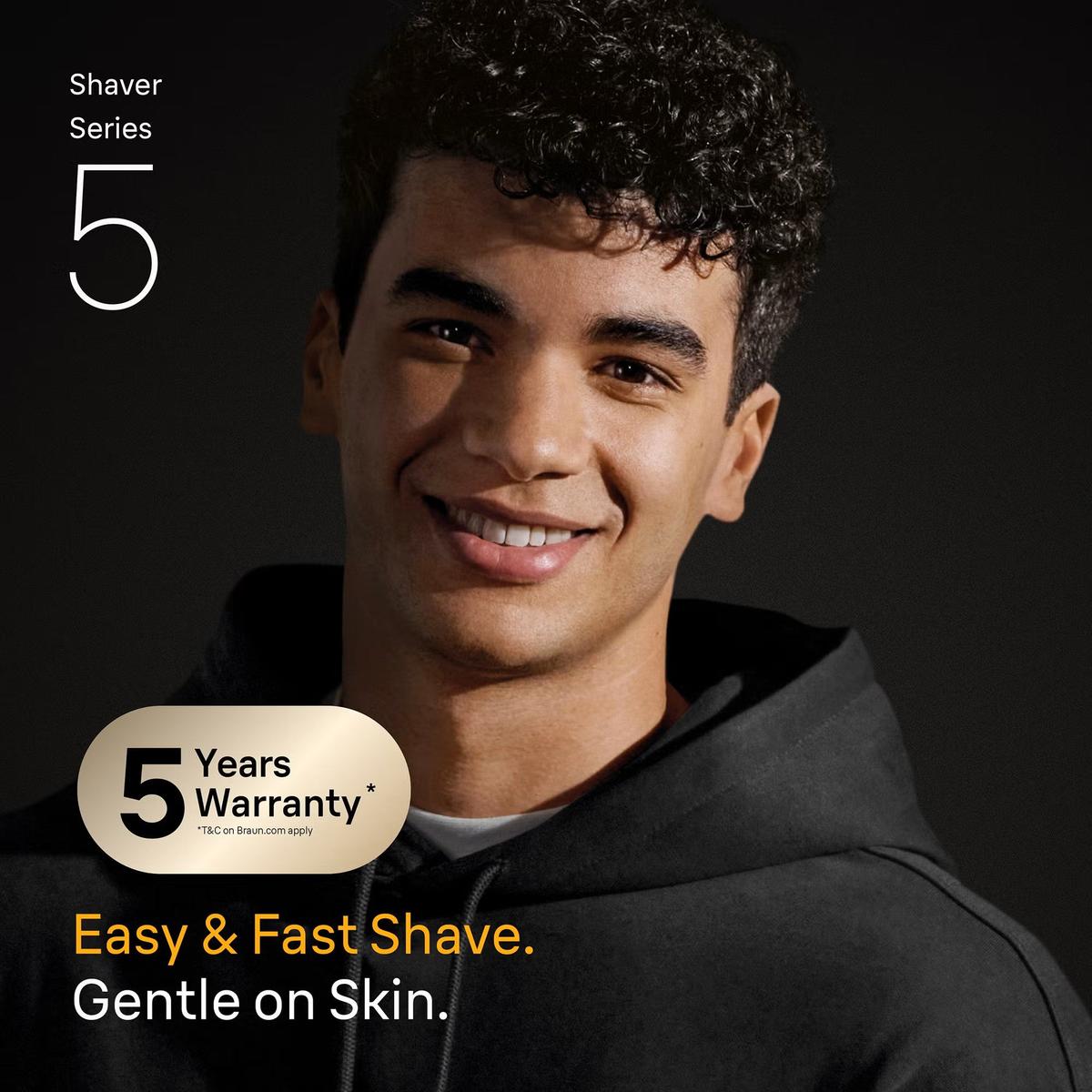 Smiling man in a black hoodie promoting the Braun Series 5 electric shaver with a 5-year warranty badge.