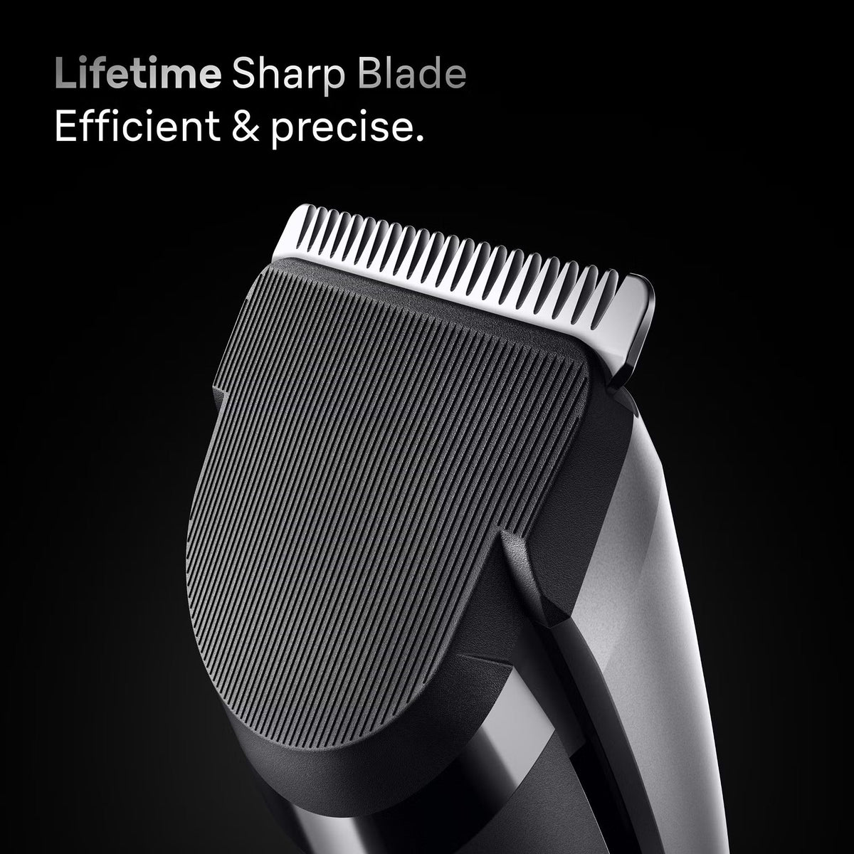 Close-up of a Braun Series 7 hair clipper featuring a sharp metal blade and a textured black rubberized grip.
