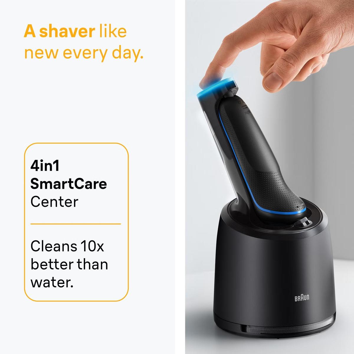 Blue Braun Series 5 electric shaver docked in a black 4-in-1 SmartCare cleaning station with a finger pressing the power button.