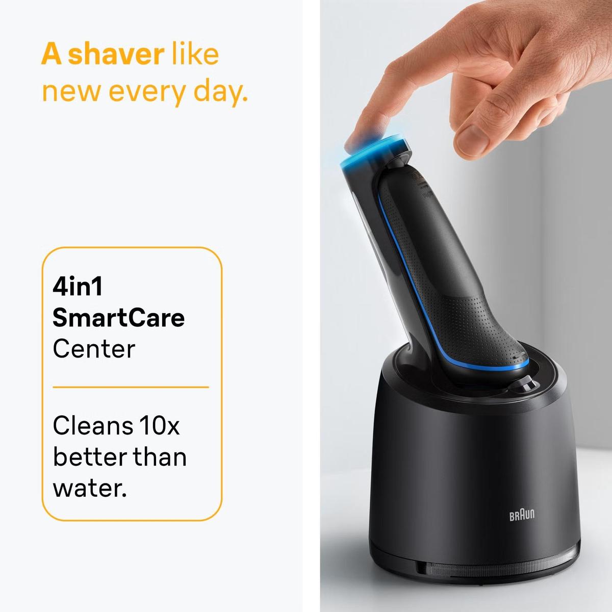 Blue Braun Series 5 electric shaver in a black 4in1 SmartCare cleaning station with a finger pressing the power button.
