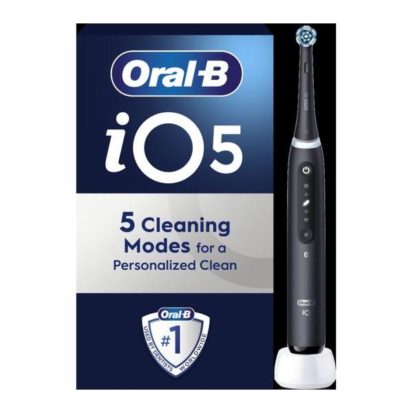 Matt black Oral-B iO 5 electric toothbrush with round brush head, charging base, and branded product packaging.