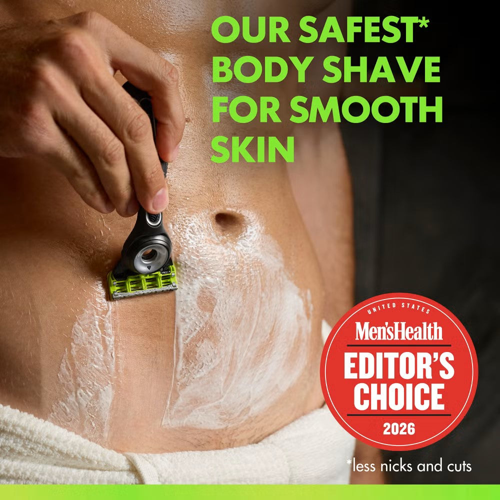 Gillette Labs body razor with a black handle and neon green blade head shaving skin covered in white shaving cream.