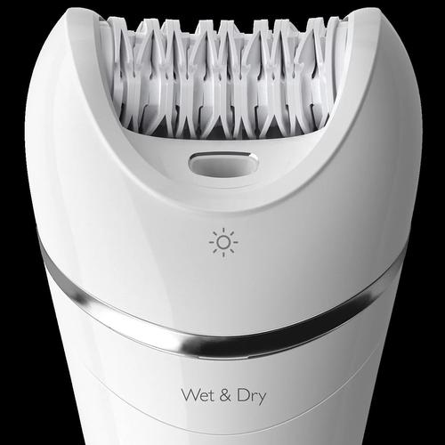 Close-up of a white Philips Series 8000 epilator head with ceramic tweezers, light indicator, and Wet & Dry label.