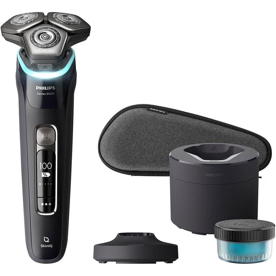 Philips Series 9000 electric shaver in matte black with digital display, charging base, cleaning pod, and travel case.