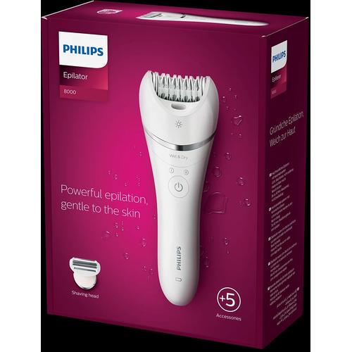 White Philips Series 8000 cordless epilator with S-shaped handle and shaving head attachment in purple product packaging.